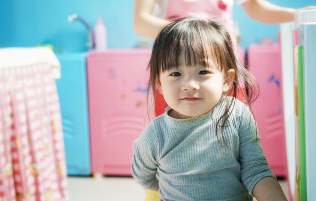 child sitting on the floor