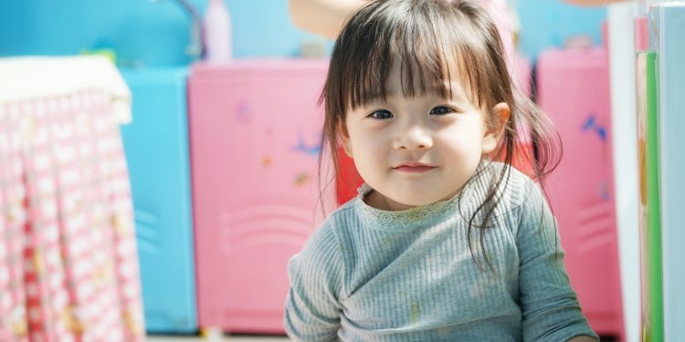 child sitting on the floor